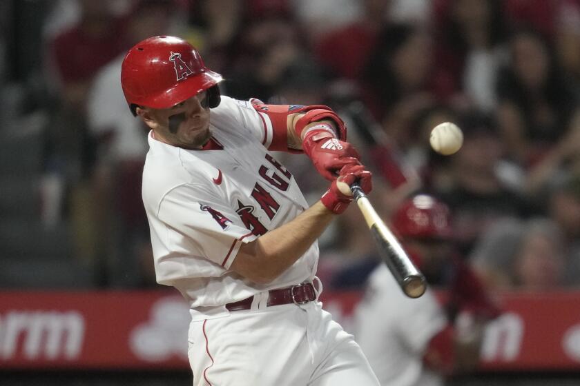 Los Angeles Angels' Zach Neto (9) doubles during the sixth inning of a baseball game.