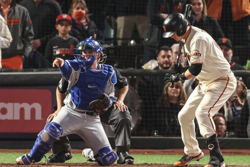 San Francisco, CA, Thursday, October 14, 2021 - LA Dodgers catcher Will Smith calls for an appeal to the first base umpire on a check swing by Giants first baseman Wilmer Flores with two strikes and two out in the bottom of the ninth inning in game five of the NLDS at Oracle Park. (Robert Gauthier/Los Angeles Times)