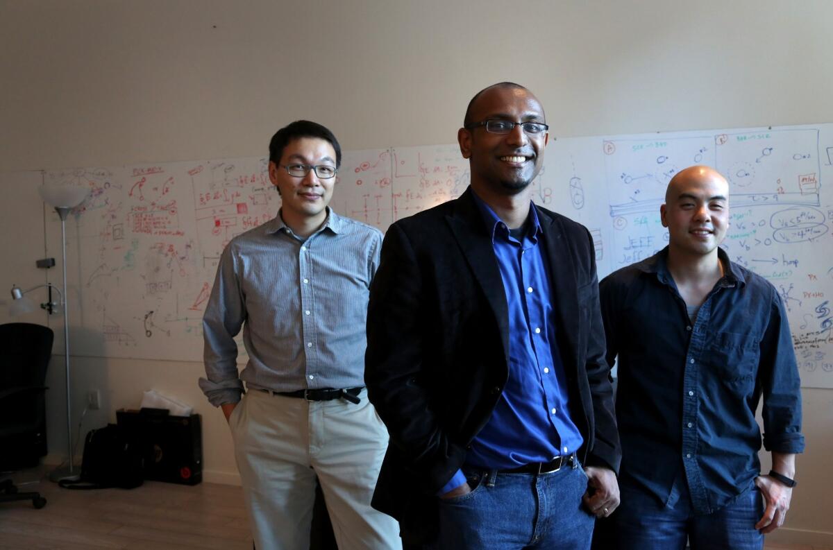 Second Spectrum COO Yu-Han Chang, left, CEO Rajiv Maheswaran, center, and CTO Jeff Su stand in their Wilshire Blvd. office in Los Angeles. Created by USC's research faculty, their firm analyzes mountains of data received from the motion-tracking cameras utilized by NBA teams.