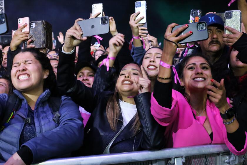 Fans scream and use their mobile phones to record Maluma during his performance at the LA3C music, food and art festival at Los Angeles State Historic Park in Los Angeles on Sunday, December 11, 2022. (Photo by James Carbone)
