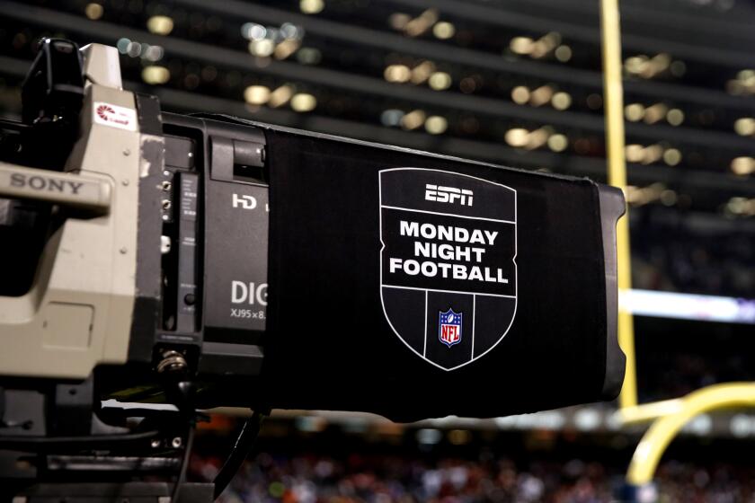 ESPN Monday Night Football TV camera is seen during the second half of an NFL football game between the Chicago Bears and Minnesota Vikings, Monday, Dec. 20, 2021, in Chicago. (AP Photo/Kamil Krzaczynski)