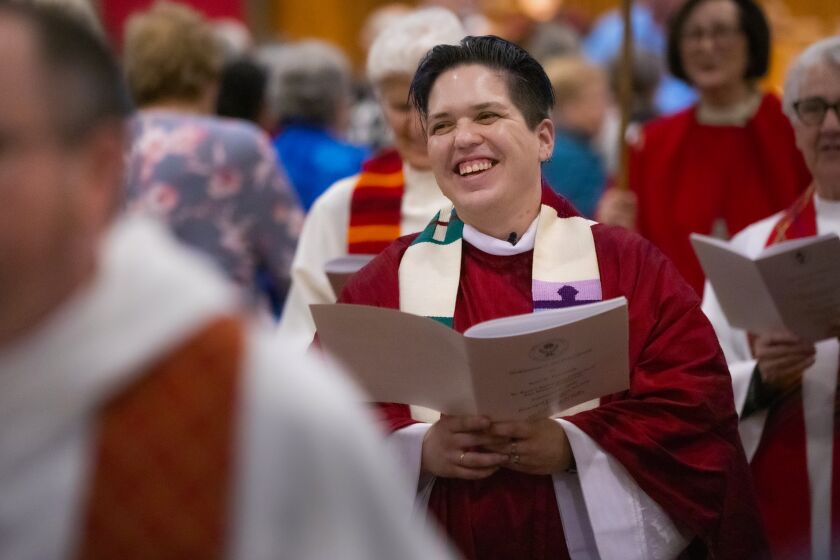 Kori Pacyniak, believed to be the first non-binary person to be ordained as a priest in the Catholic Womenpriests movement, is all smiles during the recessional procession at the end of the ordination at St. Paul's Episcopal Cathedral in Hillcrest, February 1, 2020 in San Diego, California. The ceremony was conducted by Principal Presiding Bishop Jane Via and Co-Presiding Bishop Suzanne Avison Thiel of Mary Magdalene Apostle Catholic Community, a breakaway group. St. Paul's Cathedral only hosted the ceremony and didn't have anything to do with the politics etc. behind it.