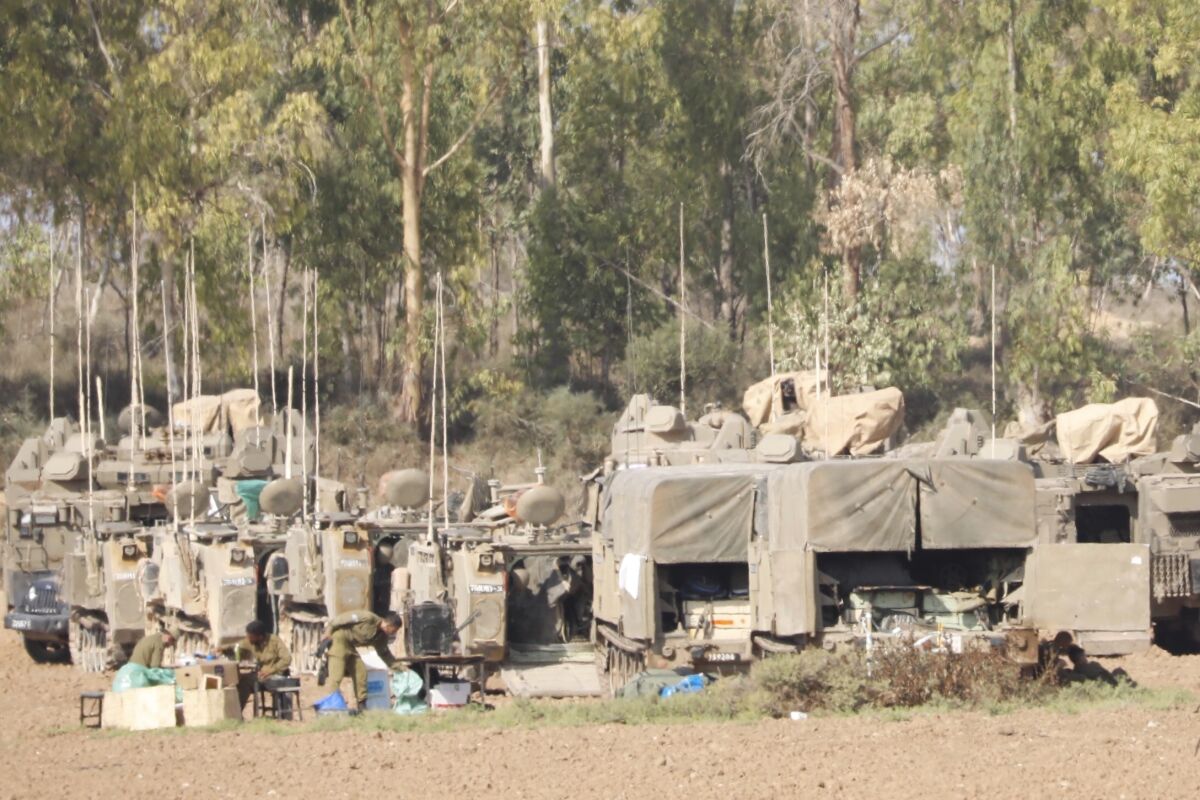 Israeli soldiers and military vehicles near the Israel-Gaza border Nov. 14.