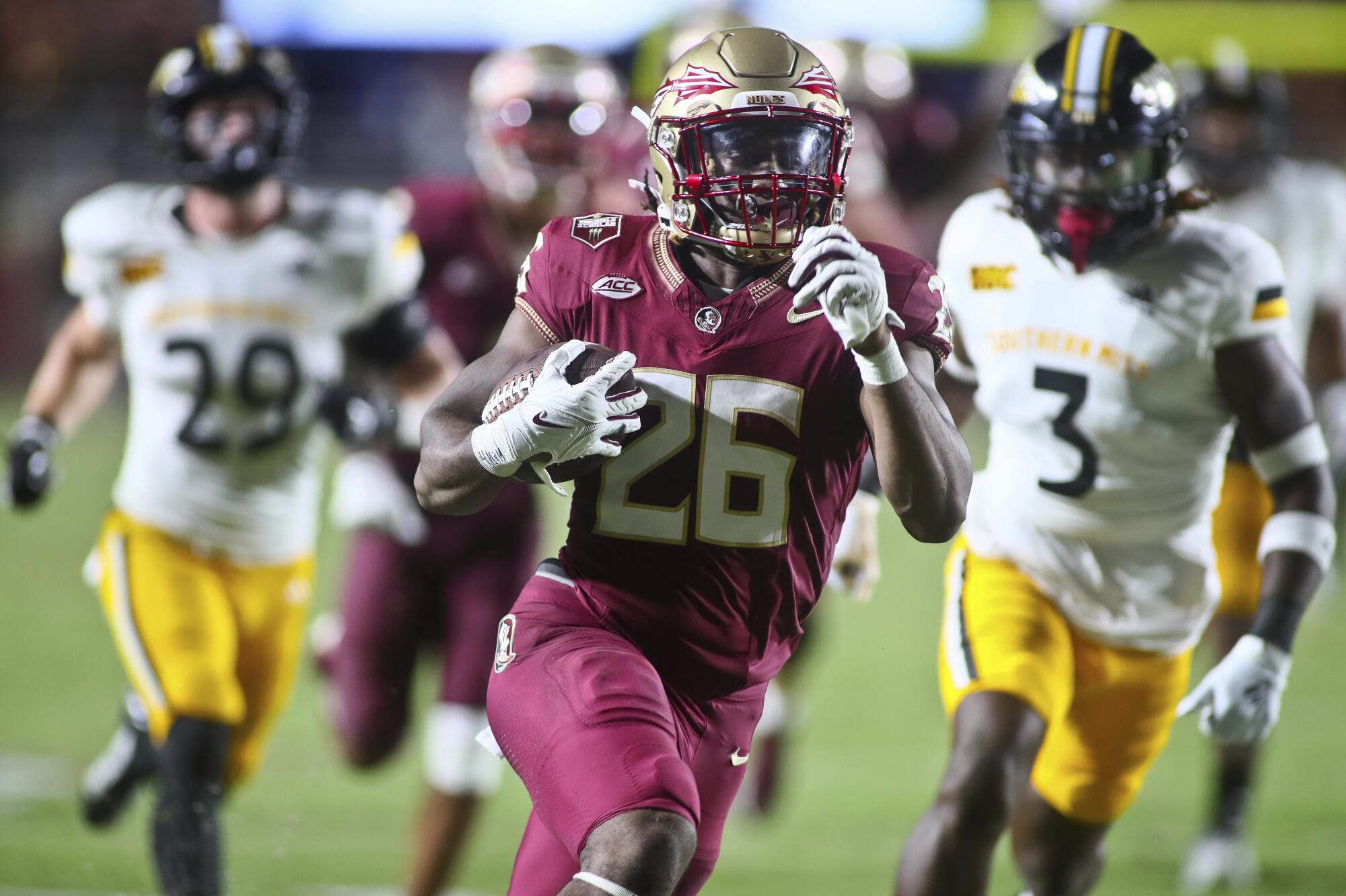 Florida State running back Caziah Holmes scores on a touchdown run against Southern Mississippi.