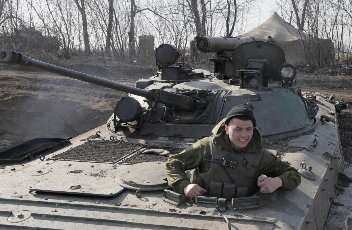 A Ukrainian serviceman takes position at the front line outside Kurahovo in the Donetsk region of Ukraine on March 11.