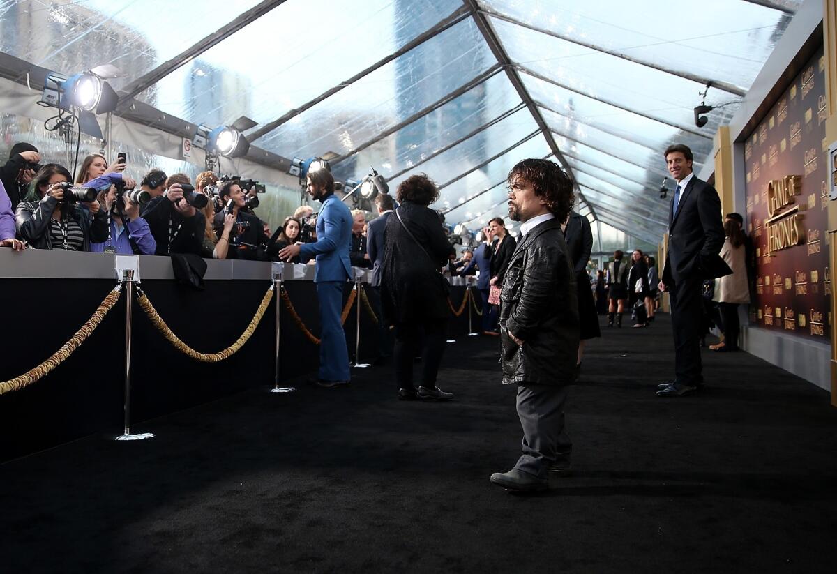 Peter Dinklage pauses for photos at the premiere for Season 5 of "Game of Thrones" in San Francisco.