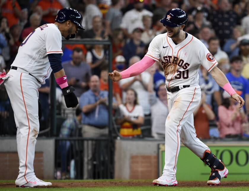 Houston Astros' Kyle Tucker (30) celebrates his three-run home run with Yuli Gurriel during the fourth inning of a baseball game against the Toronto Blue Jays, Sunday, May 9, 2021, in Houston. (AP Photo/Eric Christian Smith)