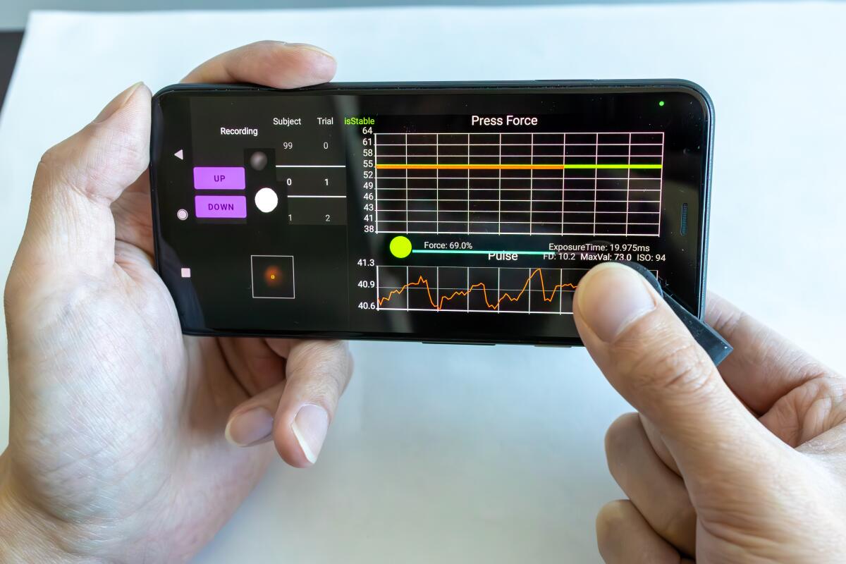 Researchers at UCSD's Jacobs School of Engineering developed a small blood pressure monitor that attaches to a smartphone.