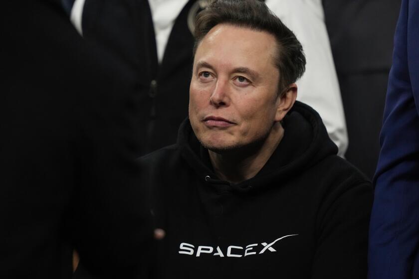 FILE - Elon Musk attends the finals for the NCAA wrestling championship, March 22, 2025, in Philadelphia. (AP Photo/Matt Rourke, File)