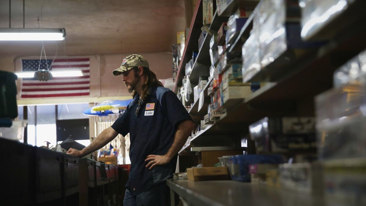 Luke Orrin, an employee at Evett's Model Shop since 2012, credits the shop with helping him adjust after he left the Marines.