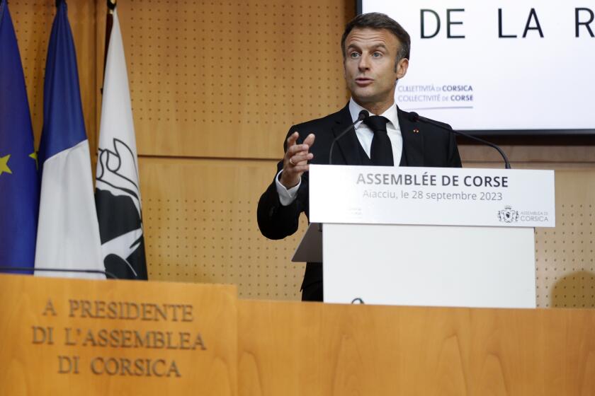 French President Emmanuel Macron addresses the Corsican Assembly in Ajaccio, as part of a three days visit in the southern French island of Corsica Thursday Sept. 28, 2023. President Emmanuel Macron proposed granting limited autonomy for Corsica on Thursday in a modest step toward nationalist sentiment on France's island in the Mediterranean. (Pascal Pochard-Casabianca, Pool via AP)