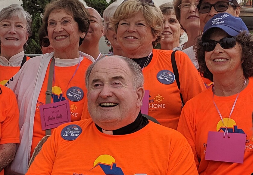 Father Joe Carroll with Ladies' Guild members before the third annual A Short Walk Home fundraiser for the homeless.