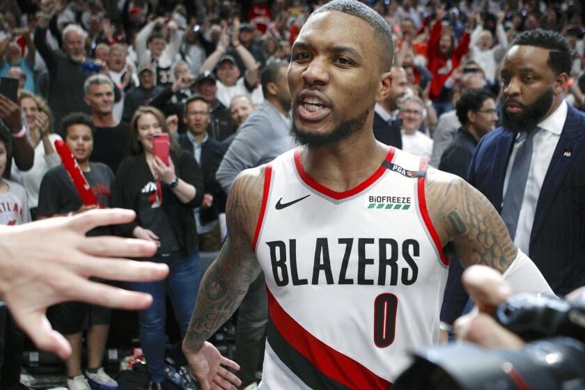 Portland Trail Blazers' Damian Lillard leaves the court after hitting the game-winning three-pointer to beat the Oklahoma City Thunder 118-115 in Game 5 of their best-of-seven first-round playoff series in Portland, Ore., Tuesday, April 23, 2019. Lillard finished with a franchise playoff-record 50 points and Portland eliminated Oklahoma City from the postseason. (Sean Meagher/The Oregonian via AP)