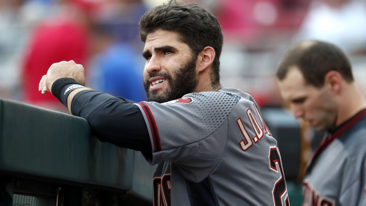 Diamondbacks right fielder J.D. Martinez watches his teammates bat during a game against the Reds on Aug. 12, 2017. Martinez is one of a handful of free agents still available.