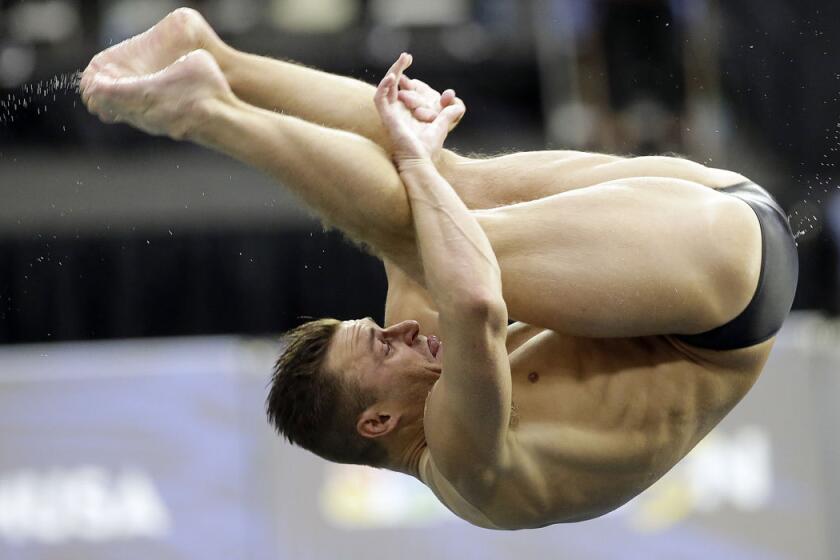 Troy Dumais dives during the men's 3-meter springboard semifinal at the U.S. Olympic diving trials on Monday, June 20, 2016, in Indianapolis. (AP Photo/