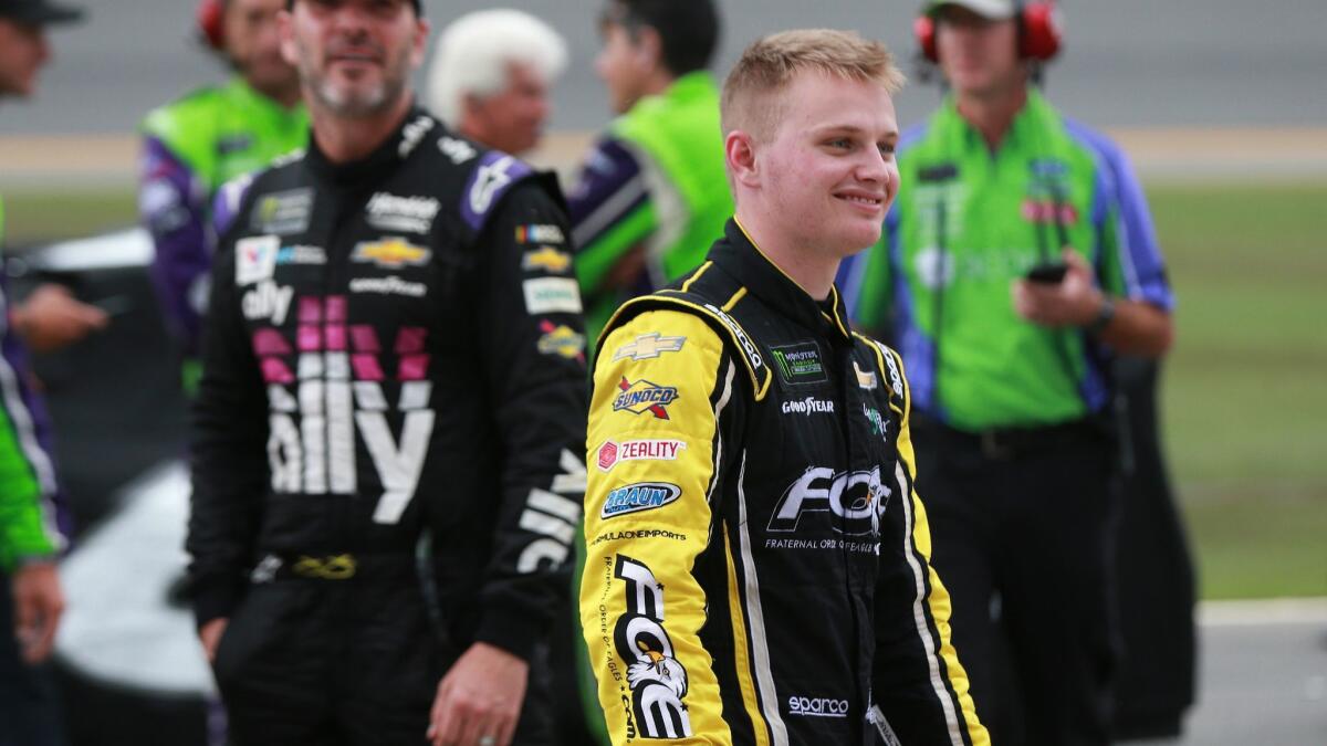 Justin Haley stands on pit road during a weather delay at Daytona International Speedway on Sunday. Haley was declared the winner after rain and lightning shortened the race by 33 laps.