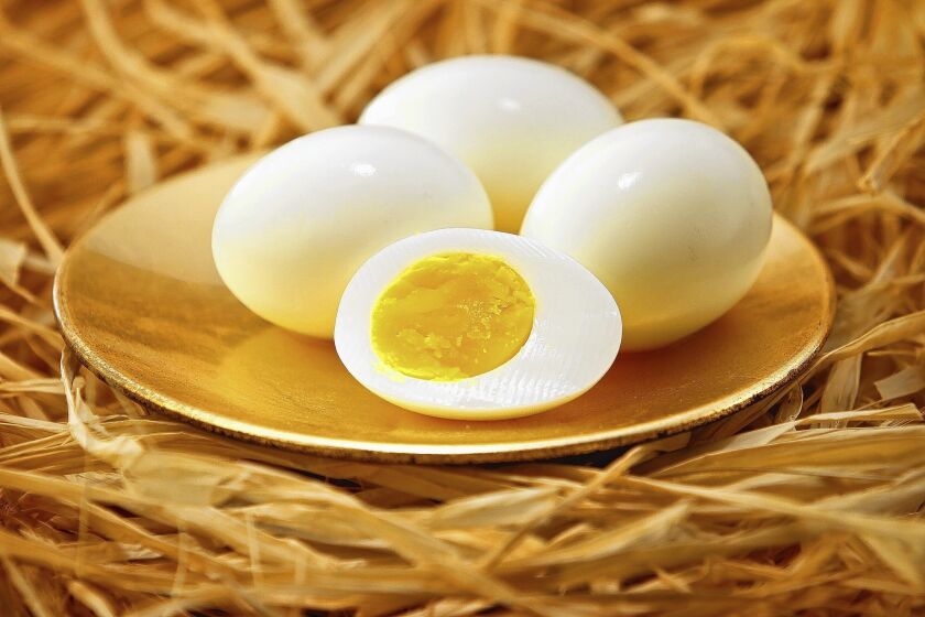 The perfectly hard-boiled egg should have an orange yolk and firm but creamy whites.