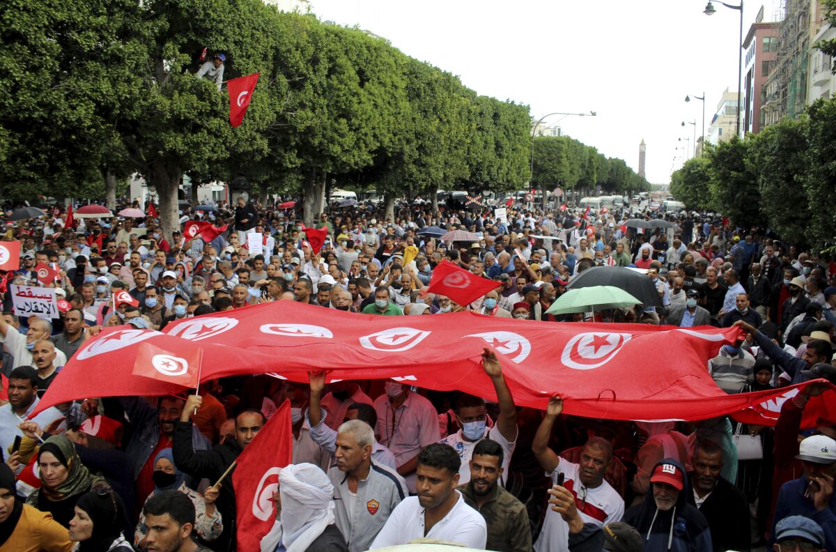 Tunisians demonstrate against Tunisian President Kais Saied in Tunis, Tunisia. Sunday, Oct. 10, 2021. Thousands of people demonstrated in Tunisia’s capital Sunday against the president’s seizure of powers in July and other moves seen as threatening the country’s democratic gains since the Arab Spring. (AP Photo/Hassene Dridi)