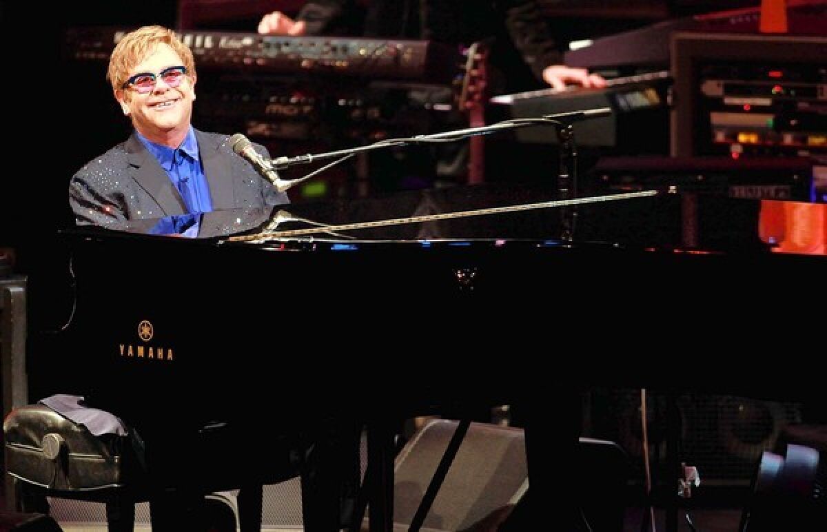 Elton John performs old and new material, including songs from his new album "The Diving Board," with USC Thornton School of Music students at Bovard Auditorium.