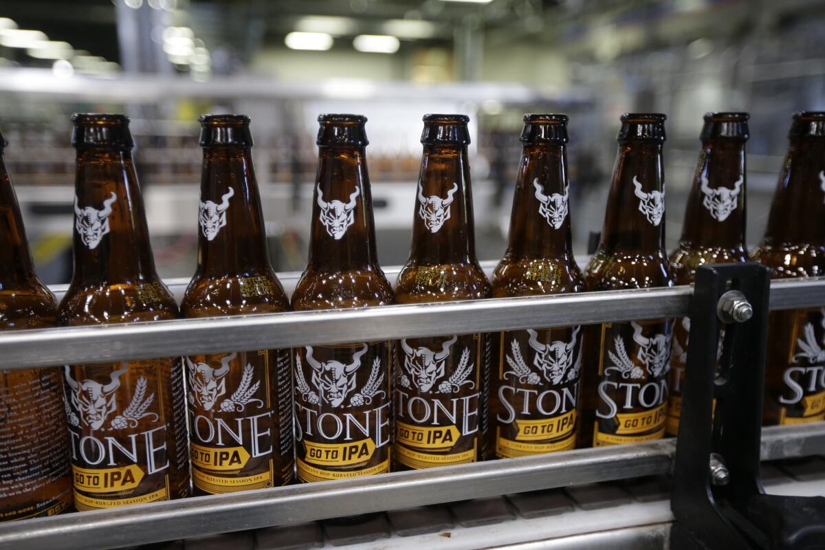 Workers brew, bottle and pack craft beer at Stone Brewery on Oct. 13, 2015, in Escondido, Calif.