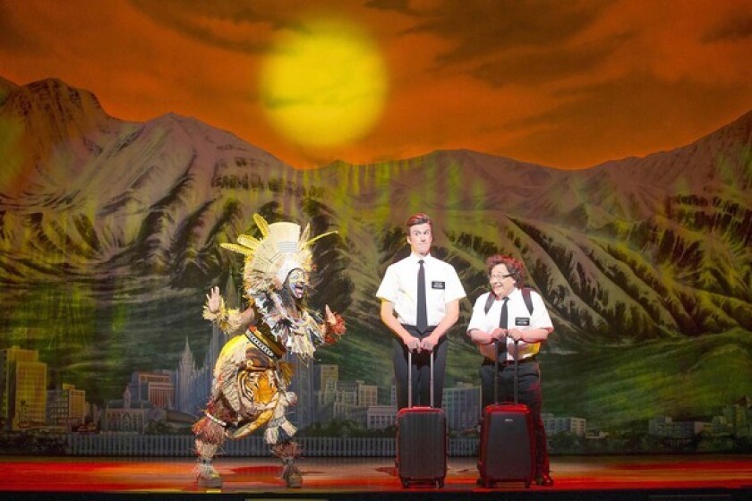 Phyre Hawkins, left, Gavin Creel and Jared Gertner in "The Book of Mormon" at the Pantages Theatre.