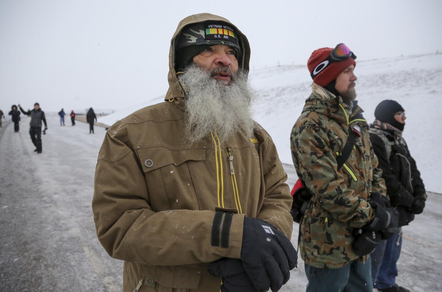 Military veterans, from left, Balko Sichel, Phillip Schlachter and Lashon Daw near the Dakota Access pipeline protest site in North Dakota.