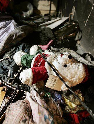A teddy bear and other items survived the flames that engulfed an illegally converted garage.