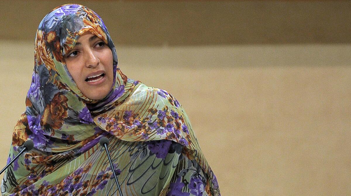 In this file photo from last October, Nobel Peace Prize winner and Yemeni journalist and activist Tawakul Karman delivers a speech during the opening of the World Forum for Democracy in the Council of Europe in Strasbourg, France.