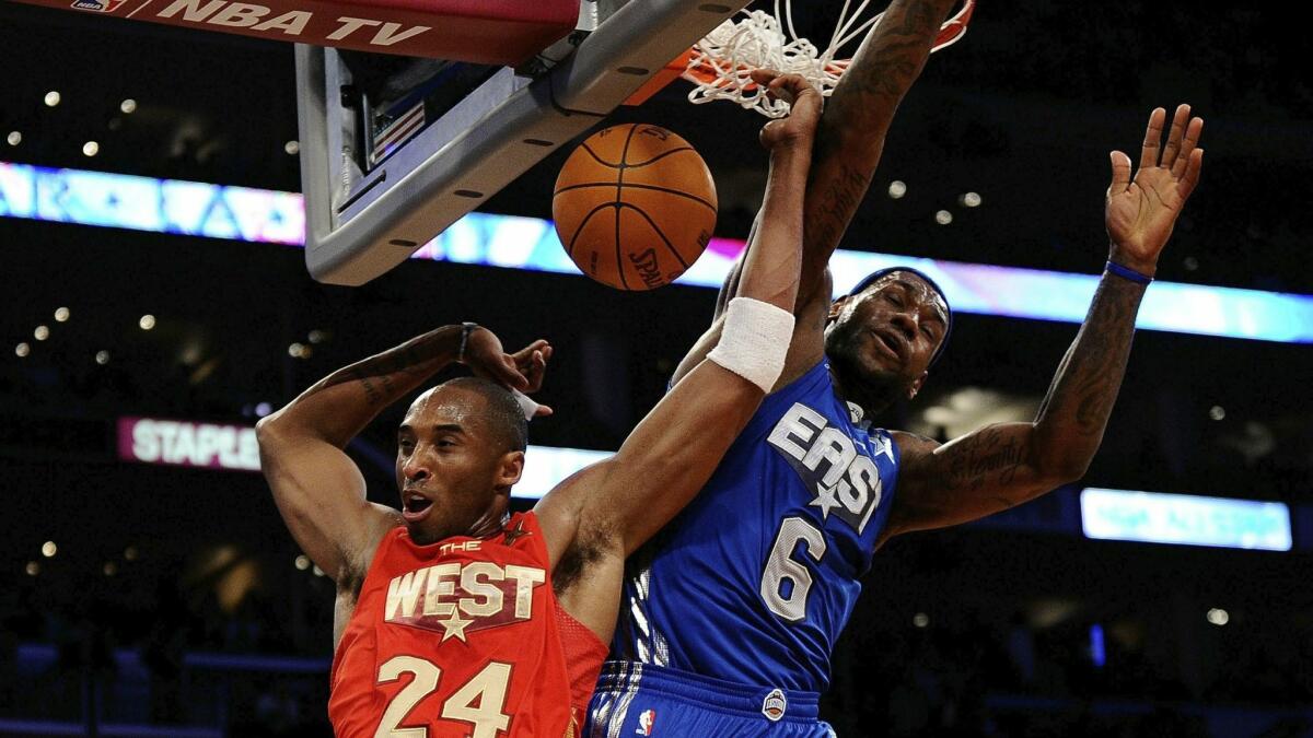 Kobe Bryant, No. 24 of the Los Angeles Lakers and the Western Conference, dunks in front of LeBron James, No. 6 of the Miami Heat and the Eastern Conference, in the second half of the 2011 NBA All-Star game at Staples Center in 2011.