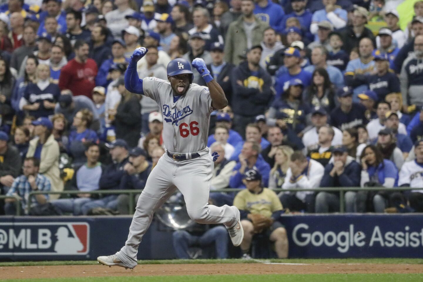 Yasiel Puig celebrates after hitting a three run homer in the sixth inning.