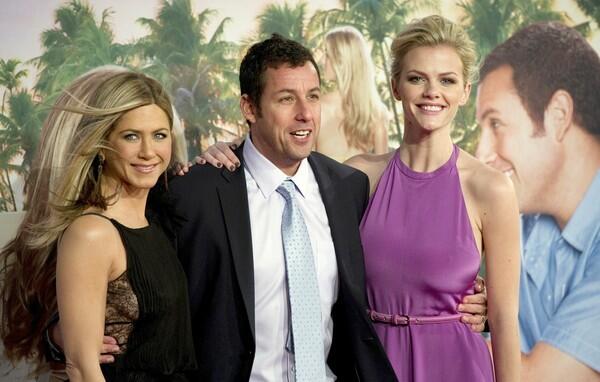 Jennifer Aniston, Adam Sandler and Brooklyn Decker pose for photographers on the red carpet for the premeire of the film "Just go with it."
