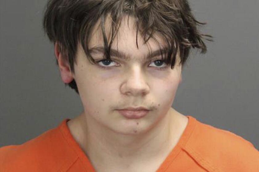 FILE - This booking photo released by the Oakland County, Mich., Sheriff's Office shows Ethan Crumbley, 15, who is charged as an adult with murder and terrorism for a shooting that killed four fellow students and injured more at Oxford High School in Oxford, Mich. Crumbley is expected to plead guilty next week, authorities said Friday, Oct. 21, 2022. (Oakland County Sheriff's Office via AP, File)