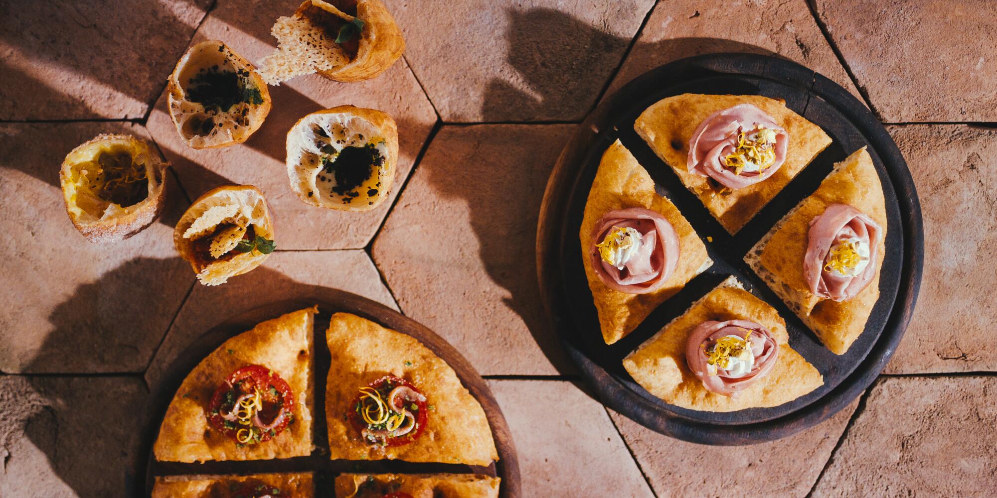 Round pizzas, cut in quarters