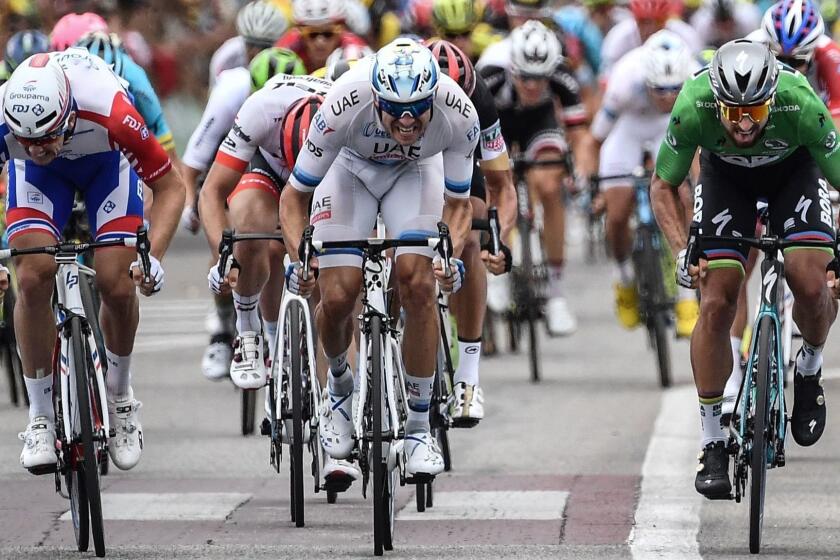 TOPSHOT - Slovakia's Peter Sagan (R), wearing the best sprinter's green jersey, sprints in the last meters to cross the finish line and win, ahead of Norway's Alexander Kristoff (C) and France's Arnaud Demare (L), the 13th stage of the 105th edition of the Tour de France cycling race, between Le Bourg-d'Oisans and Valence, on July 20, 2018. / AFP PHOTO / Jeff PACHOUD / ALTERNATIVE CROP JEFF PACHOUD/AFP/Getty Images ** OUTS - ELSENT, FPG, CM - OUTS * NM, PH, VA if sourced by CT, LA or MoD **