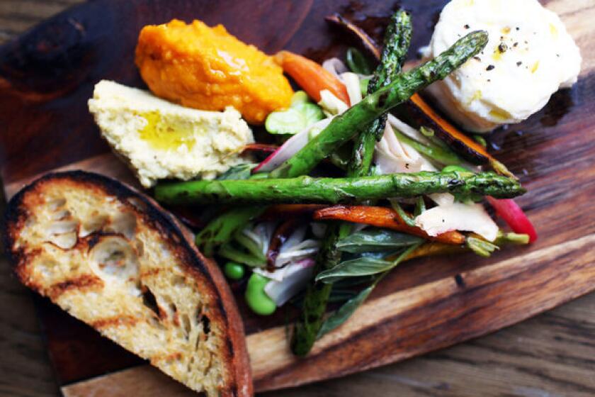 The Farmer's Plate comes with spring vegetables, carrot puree, fava puree, bur rata and grilled toast.