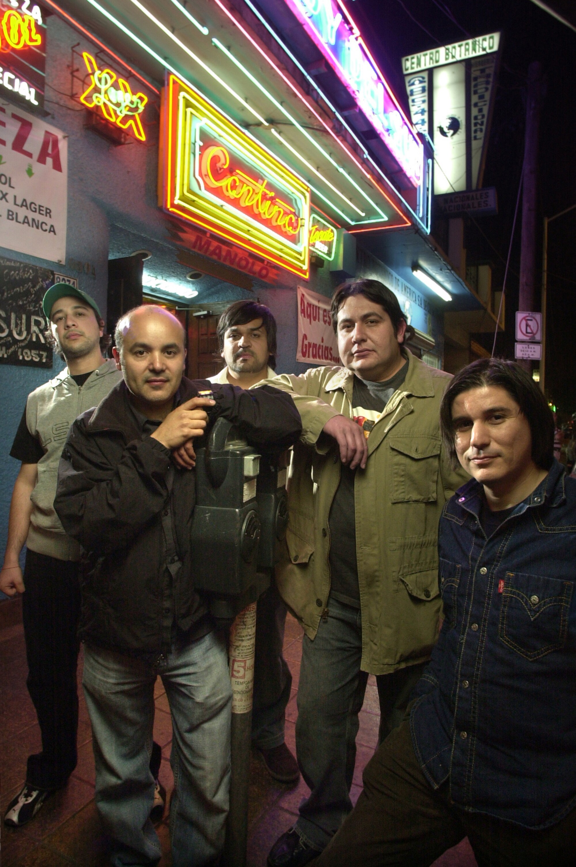 Members of the band Nortec Collective gather in front of Dandy del Sur in Tijuana's Centro district.