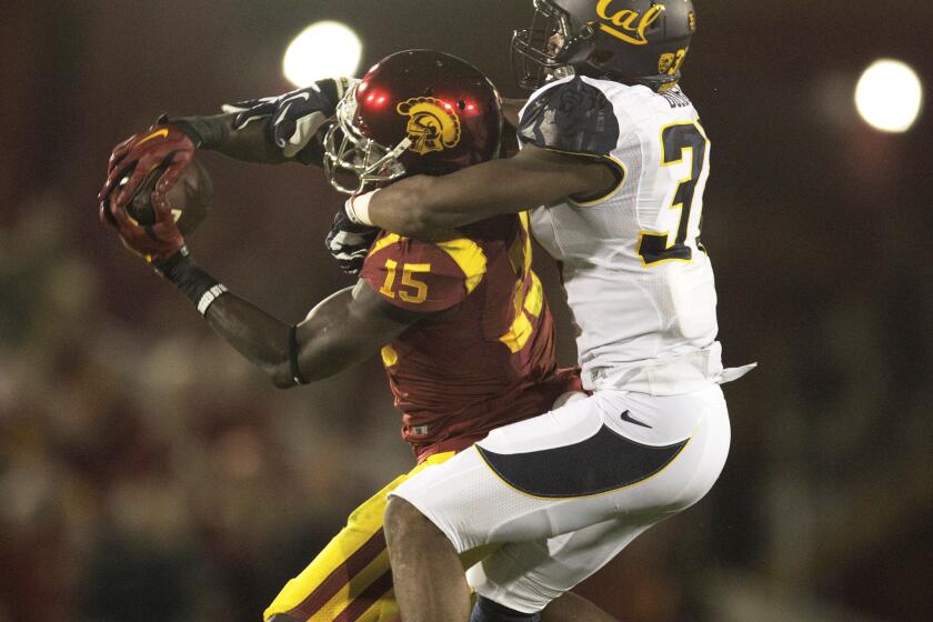 USC wide receiver Nelson Agholor hangs on for a 34-yard touchdown pass on Nov. 13.