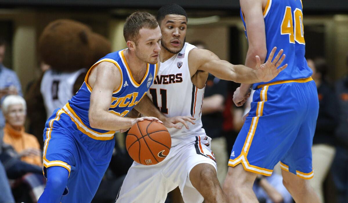 UCLA's Bryce Alford, left, tries to get past Oregon State's Malcolm Duvivier during the first half on Wednesday.