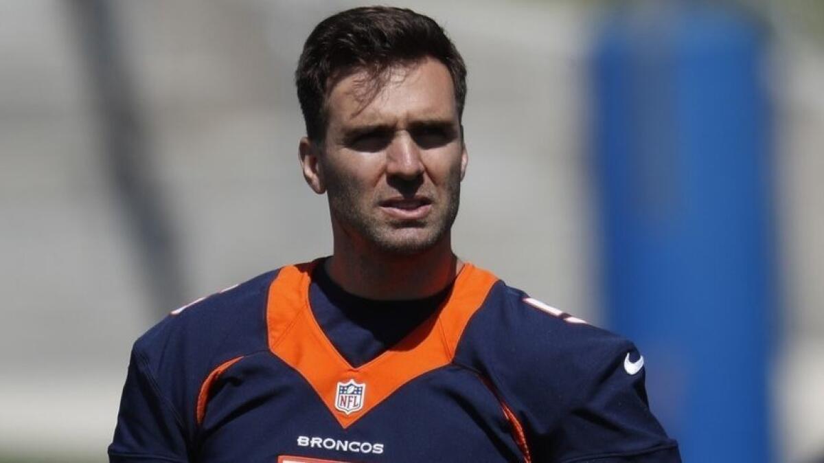 Denver Broncos quarterback Joe Flacco takes part in drills May 13 in Englewood, Colo.