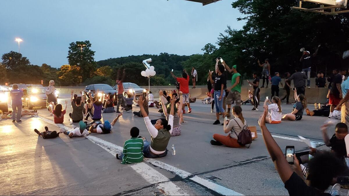 People block on Interstate 376 near Pittsburgh to protest the shooting death of Antwon Rose.