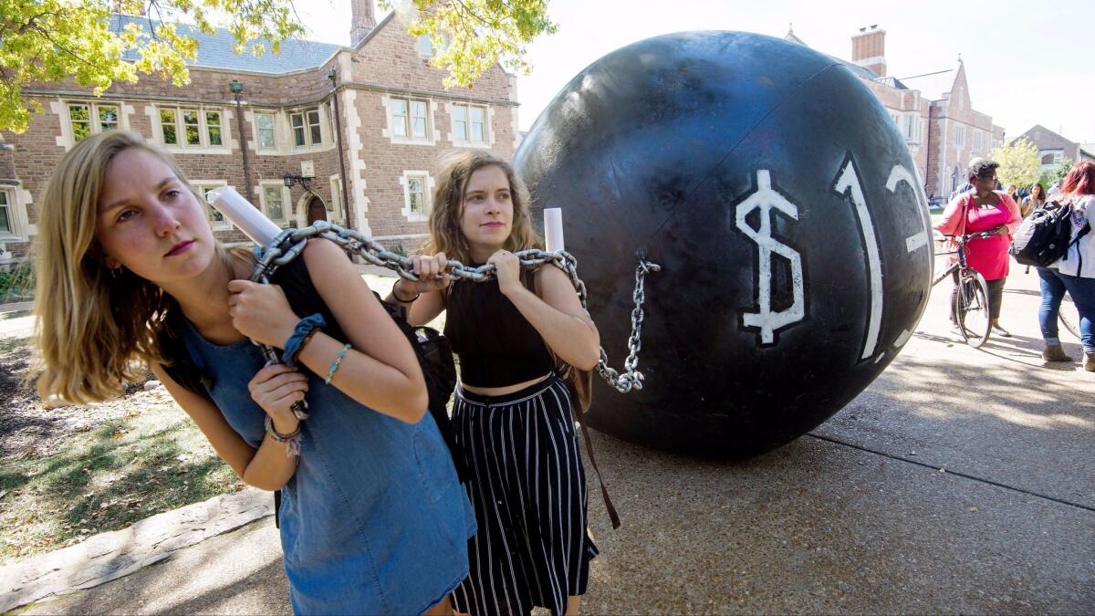 Students at Washington University in St. Louis pull a mock ball and chain