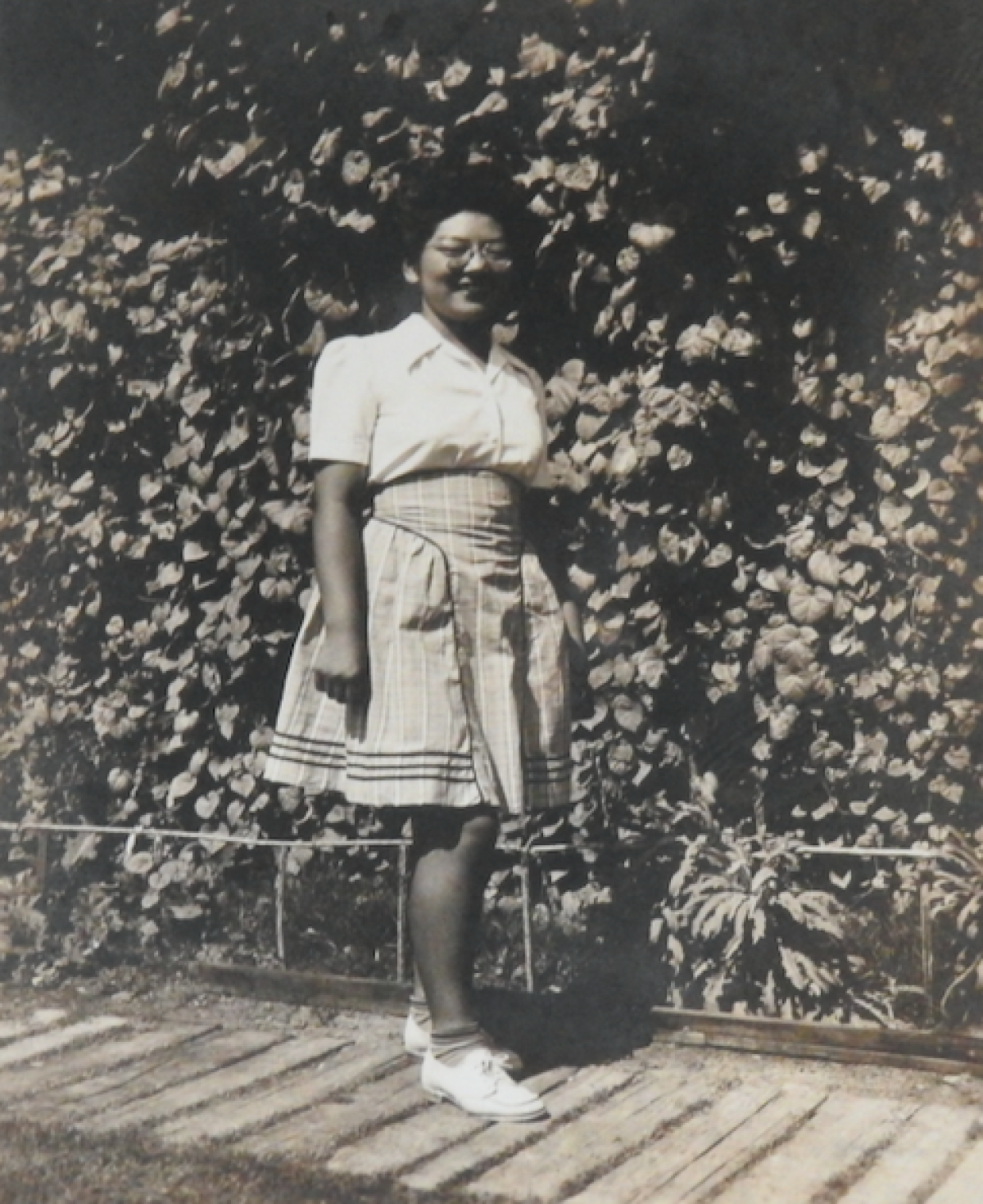 My mom — Misako Katano — in 1944 at the war relocation camp in Poston. Her dress was made by one of her sisters.