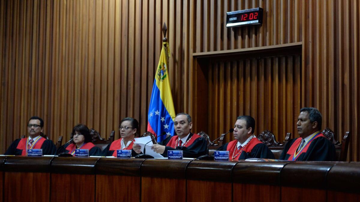Venezuela's Supreme Court President Maikel Moreno speaks at court headquarters in Caracas on April 1, 2017. Venezuela's Supreme Court abandoned measures to seize power from the opposition-controlled legislature.