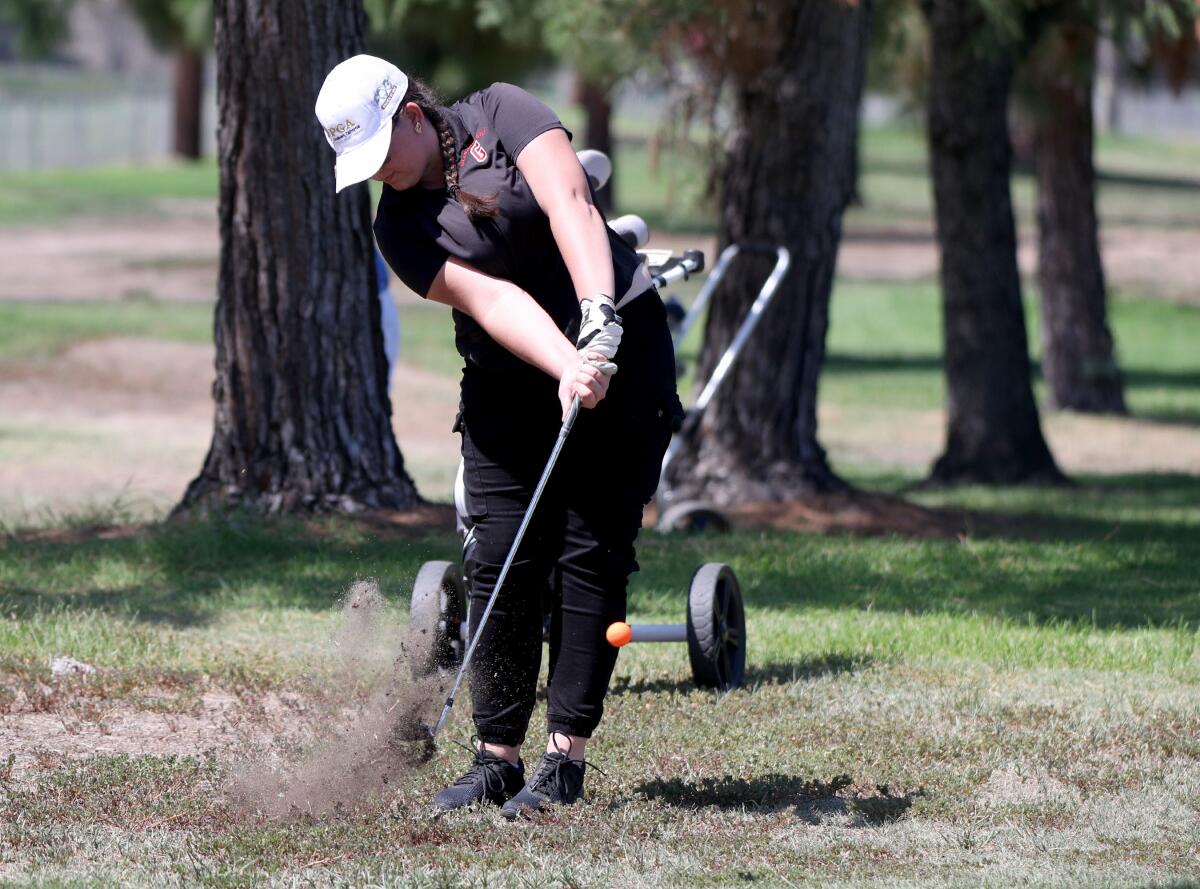 Glendale High School golfer Nicole Ser-Manukyan hits out of the rough during Pacific League golf match at Altadena Golf Course in Altadena on Wednesday, Sept. 4, 2019.