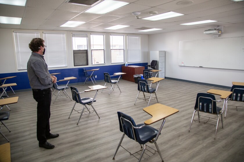 President of Cristo Rey High School, Bob Nascenzi looks over a newly renovated classroom Thursday