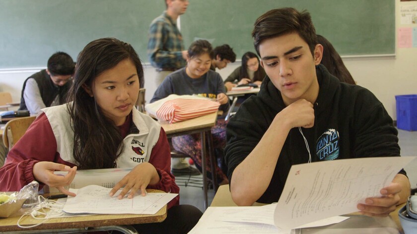 Two high school students studying in a scene from the documentary “Try Harder.”