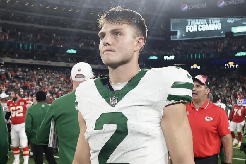 New York Jets quarterback Zach Wilson (2) walks off the field after playing against the Kansas City Chiefs.