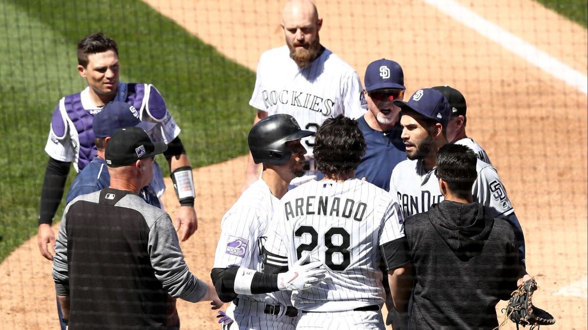Benches clear as a brawl breaks out between the Colorado Rockies and the San Diego Padres in the third inning at Coors Field on April 11.