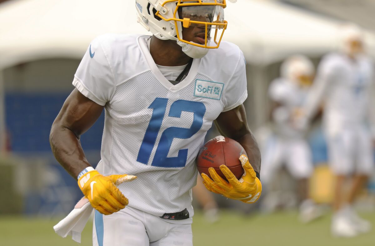 Chargers rookie receiver Joe Reed runs with the ball in practice.