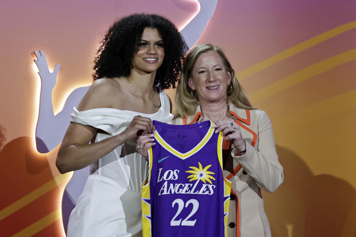Tennessee's Rae Burrell poses for a photo with WNBA Commissioner Cathy Engelbert.